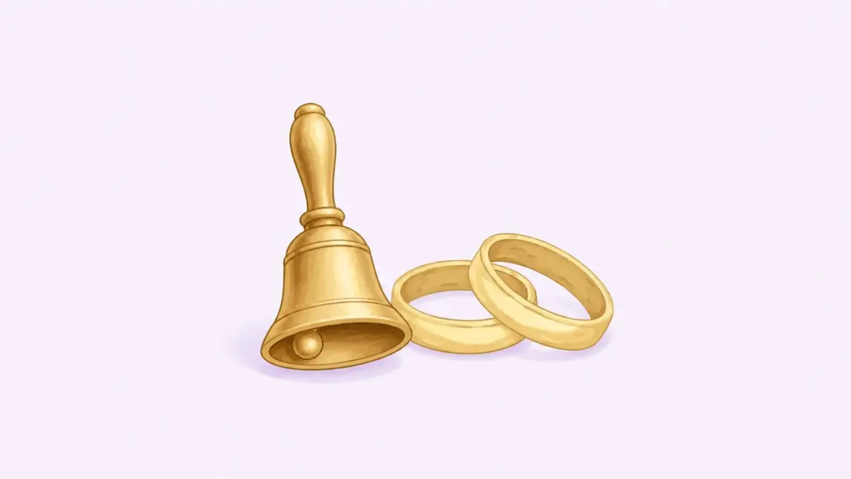 A brass handbell beside two interlocking rings